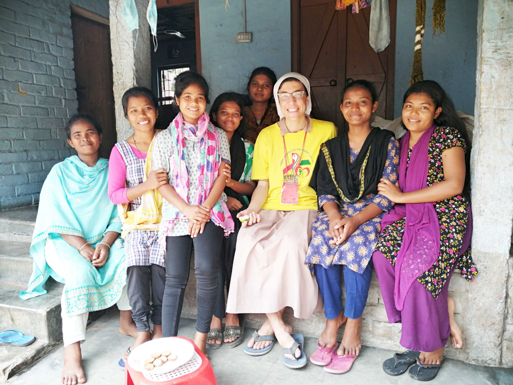 Sr. Lorenza Raffaella Radini and Indigenous youth Sr. Lorenza Raffaella Radini visits a rural Indigenous village while she attends national youth day in the Dinajpur diocese. (Stephan Uttom Rozario)