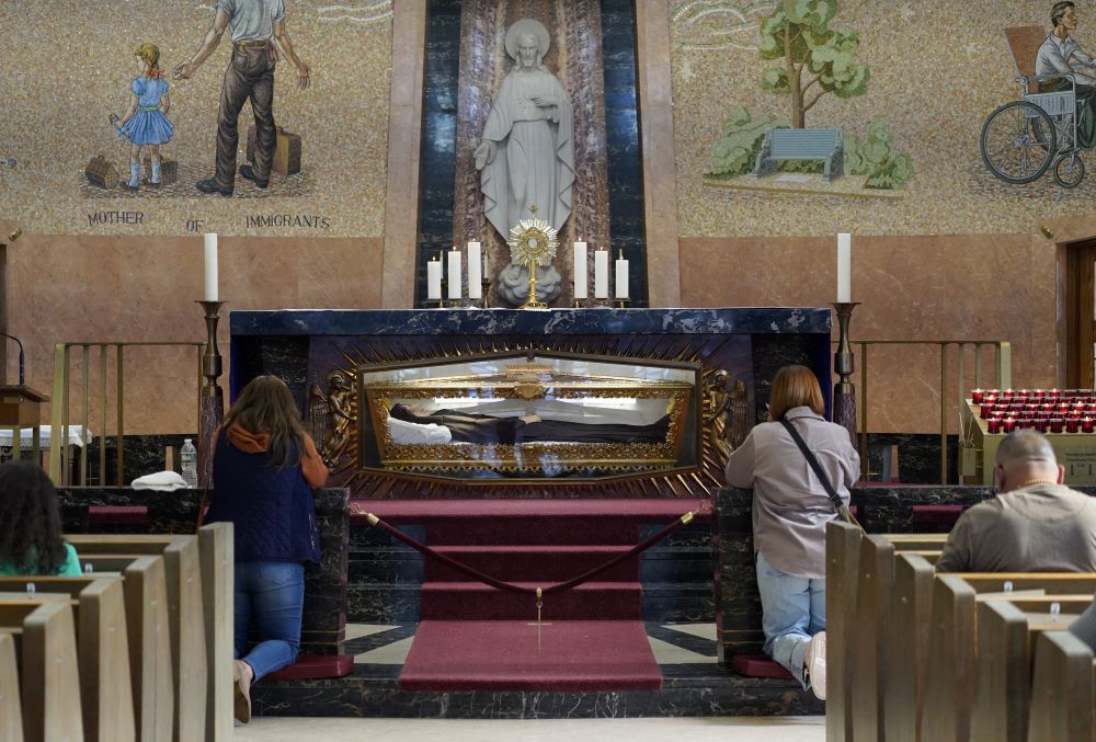 People pray during Eucharistic adoration in the chapel of St. Frances Cabrini Shrine in Upper Manhattan in New York City on March 3, 2024. Mother Cabrini, canonized in 1946, is the patron saint of immigrants. Her remains are encased in a glass casket embedded in the chapel's altar. (OSV/Gregory A. Shemitz)