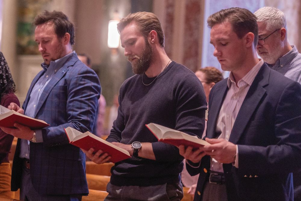 three men at Mass