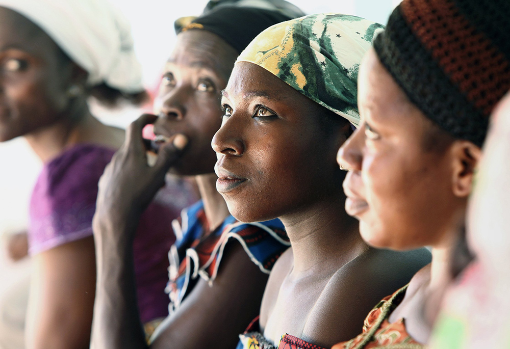 Women wait outside a clinic at Our Lady of Apostles Hospital in Akwanga, Nigeria, in this 2010 file photo. The rural Catholic hospital treats 1,500 patients with HIV with life-saving antiretroviral therapies. Like many such efforts, the hospital has been reliant on PEPFAR funding from the U.S. (CNS/Nancy Phelan Wiechec)