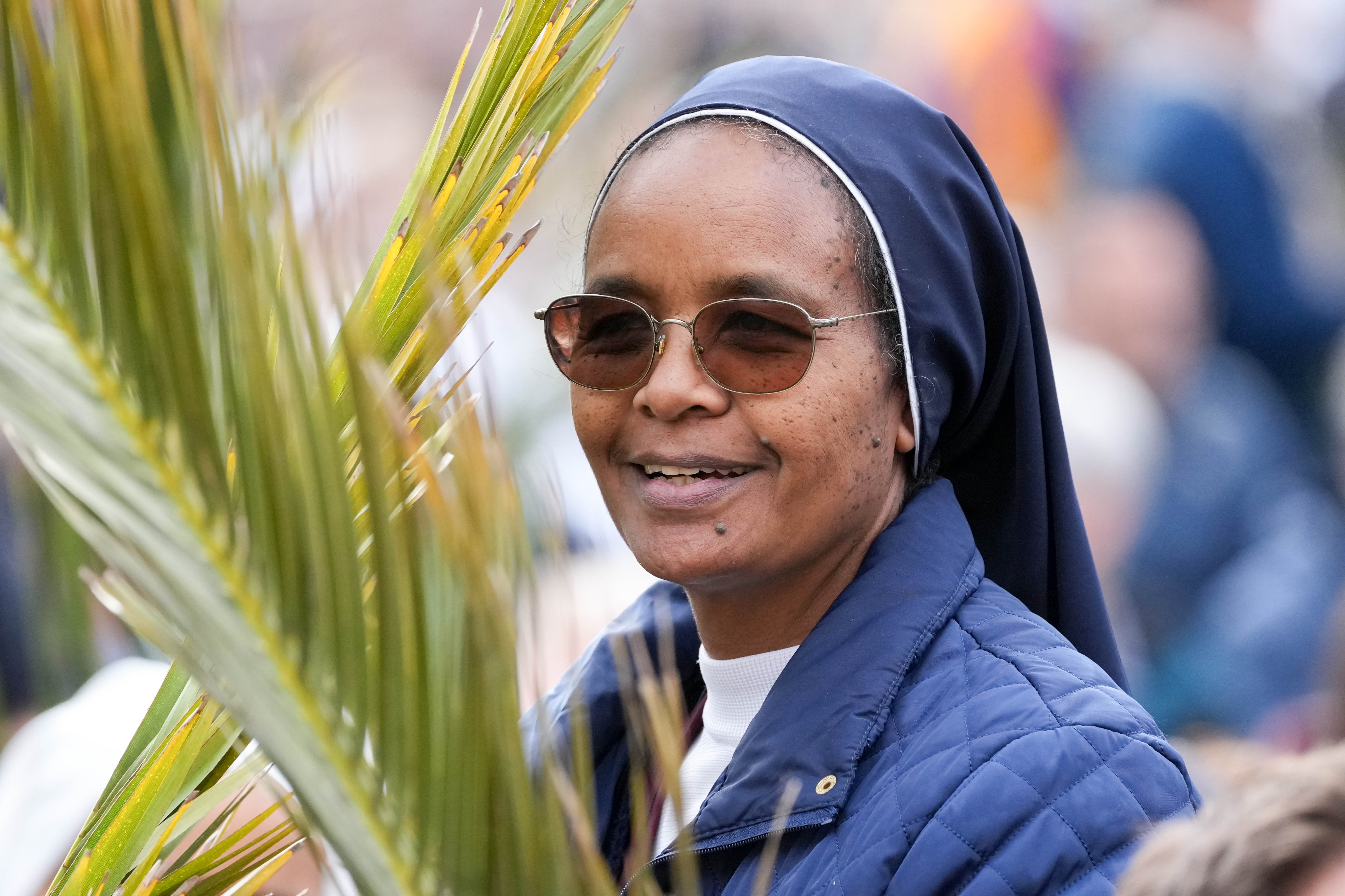 Nun with palms