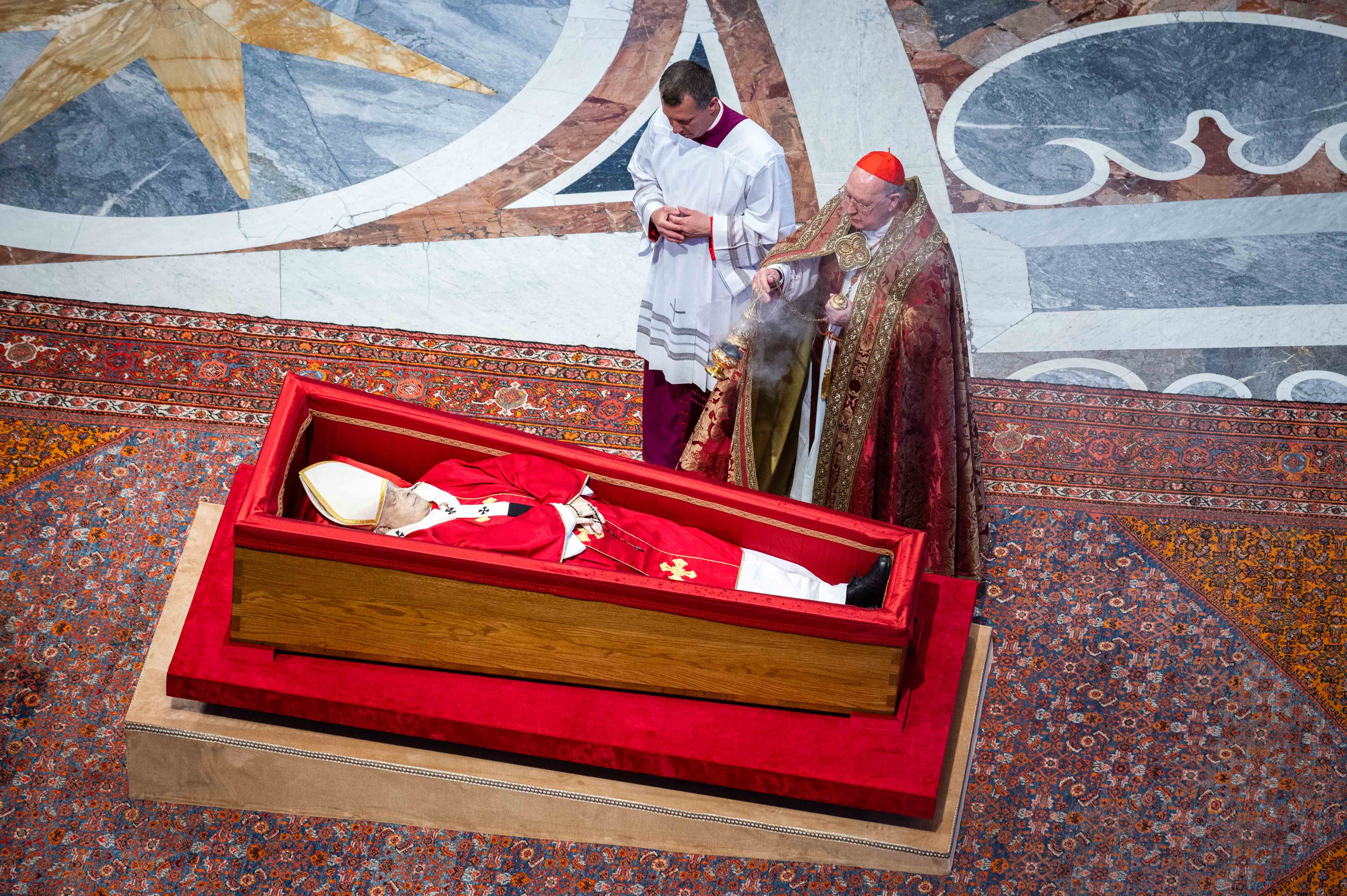 Cardinal Kevin J. Farrell incenses the body of Pope Francis