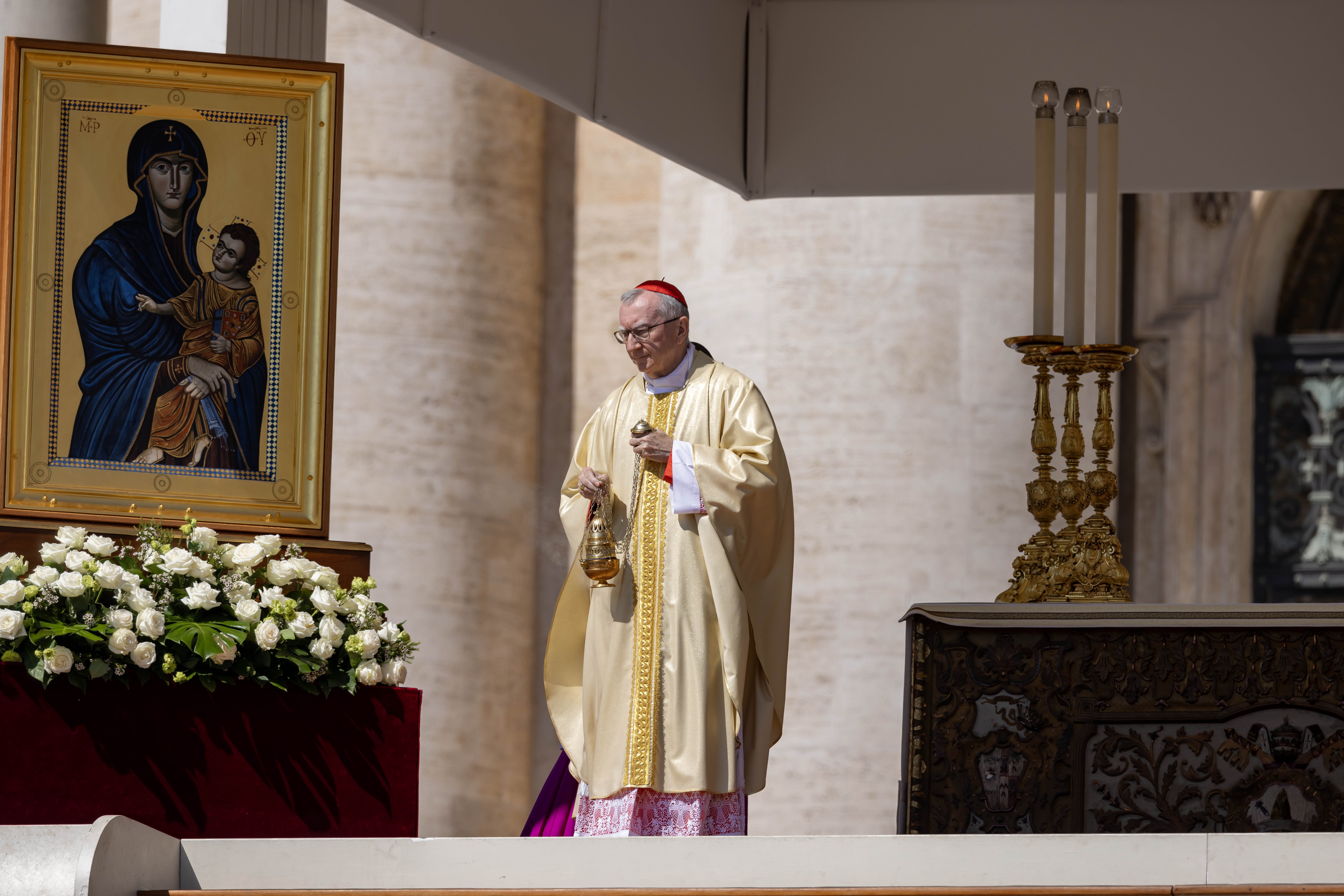 Cardinal Pietro Parolin, former Vatican secretary of state, venerates the icon of "Salus Populi Romani" while celebrating Mass on the second day of the "novendiali" -- nine days of mourning for Pope Francis marked by Masses -- in St. Peter's Square at the Vatican April 27, 2025. (CNS photo/Pablo Esparza)