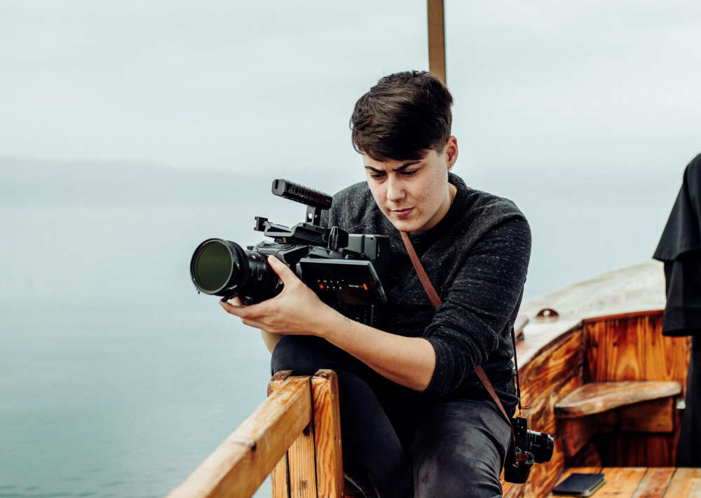 Maxwell Kuzma films while on boat.