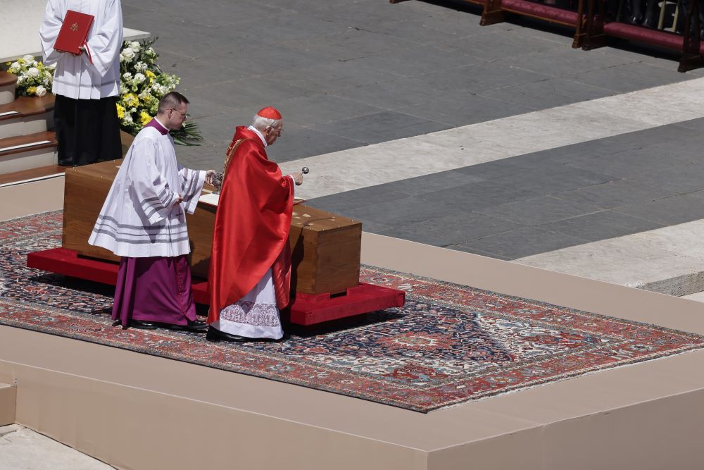 Cardinal Giovanni Battista Re, dean of the College of Cardinals, blesses the casket of Pope Francis with holy water during the pope's funeral. (CNS/Pablo Esparza)