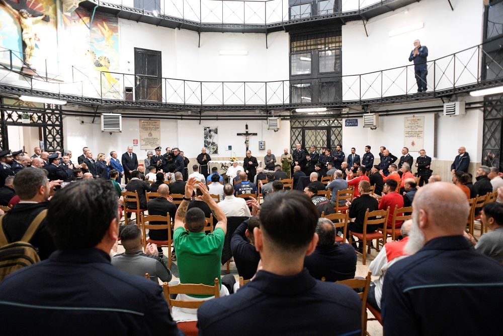 Pope Francis speaks to inmates during a Holy Thursday visit to Rome's Regina Coeli jail.