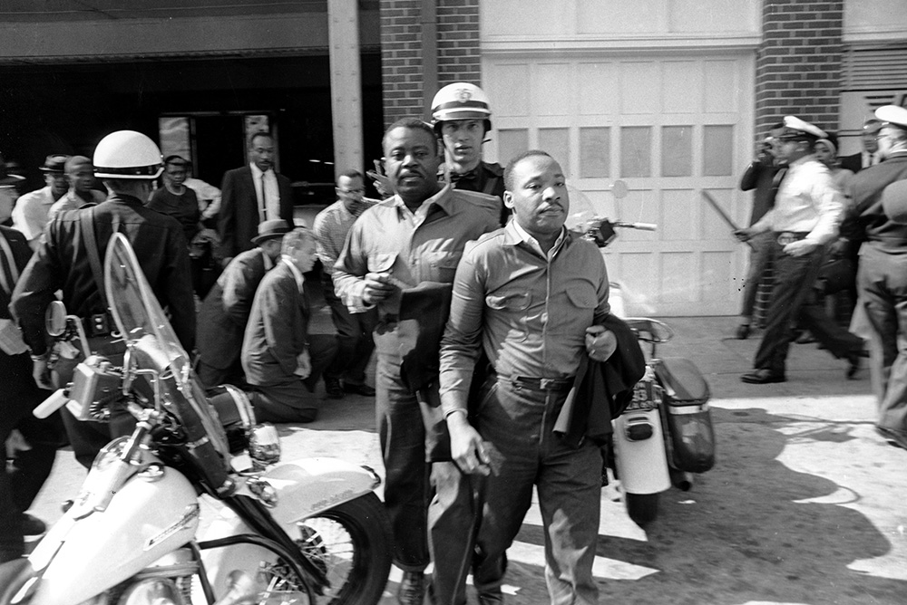 Police arrest the Rev. Martin Luther King Jr. (foreground) and the Rev. Ralph Abernathy at a Civil Rights demonstration in Birmingham, Ala., on April 12, 1963. (AP)