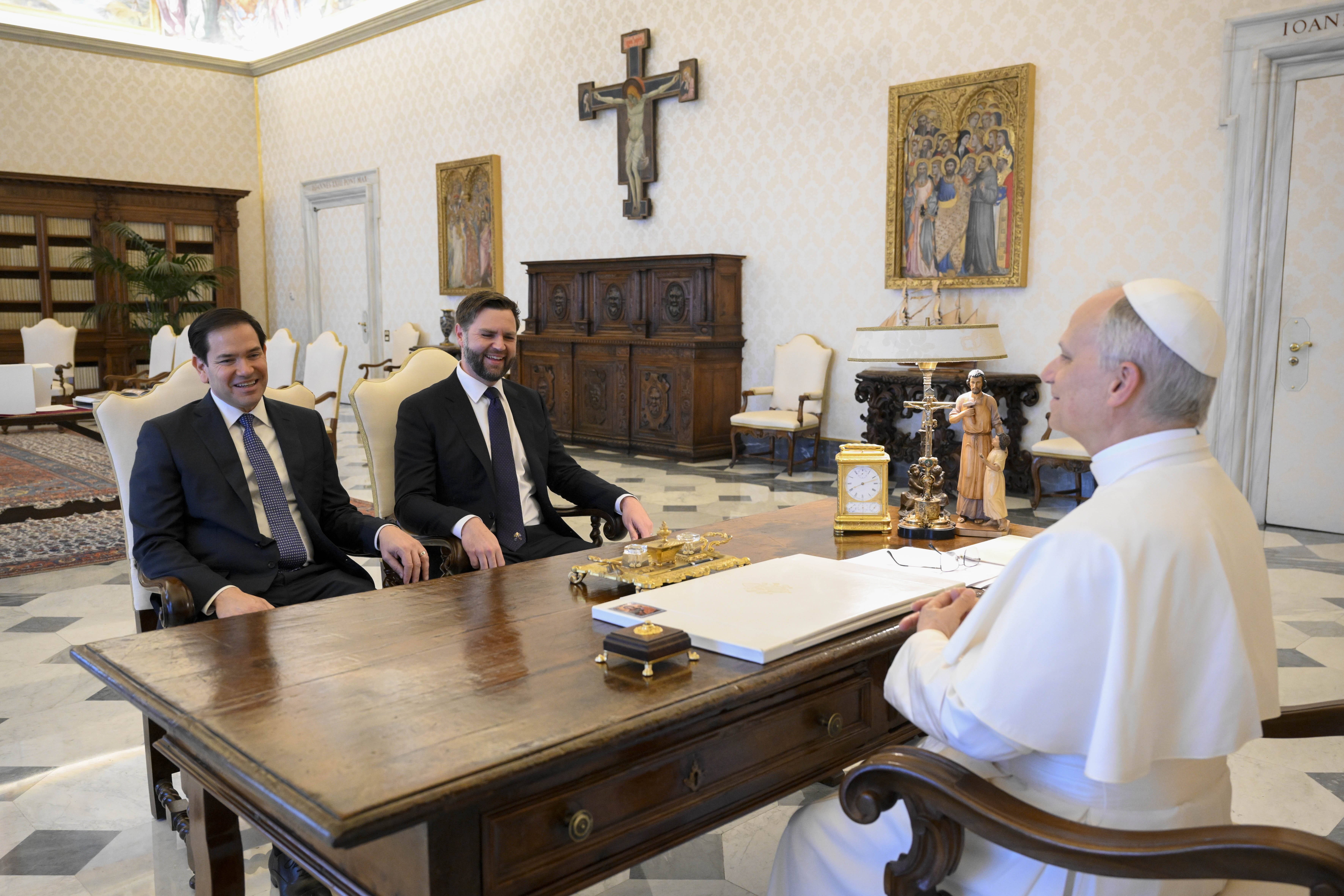 Pope Leo XIV meets with U.S. Vice President JD Vance and Secretary of State Marco Rubio in the library of the Apostolic Palace at the Vatican May 19, 2025. (CNS photo/Vatican Media)