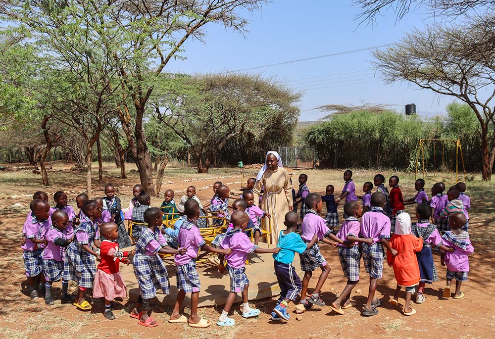 Sr. Felister Maria Kwamboka, who belongs to the Franciscan Sisters of St. Joseph Asumbi, plays with children at the nursery school that is part of the Baragoi Catholic Mission in Samburu County, northern Kenya. The school provides a safe space for children from all the tribes in Baragoi to learn and play. (Lourine Oluoch)