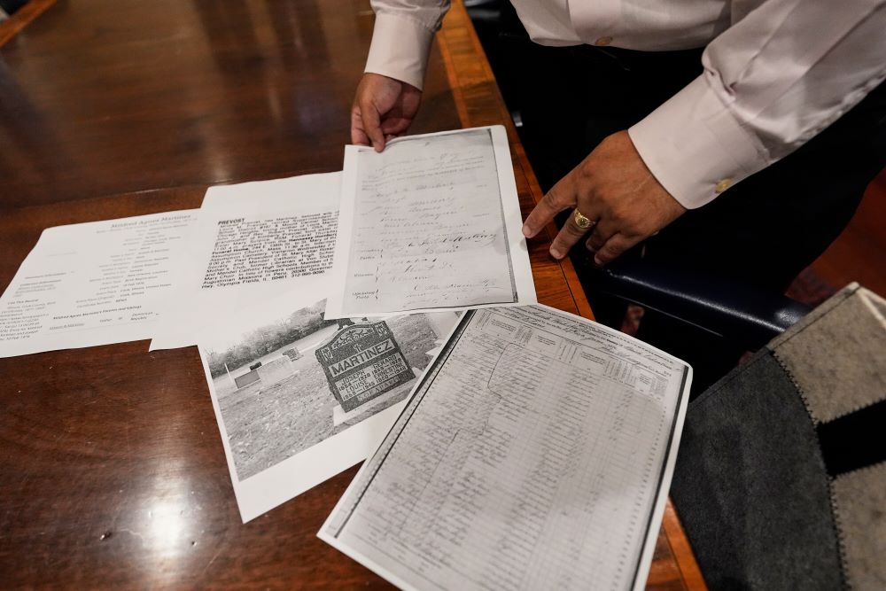 Jari Honora, family historian for the Historic New Orleans Collection, shows genealogy material related to the grandparents of Pope Leo XIV in New Orleans May 9. (AP/Gerald Herbert) Jari Honora, family historian for the Historic New Orleans Collection, shows genealogy material related to the grandparents of Pope Leo XIV in New Orleans May 9. (AP/Gerald Herbert)