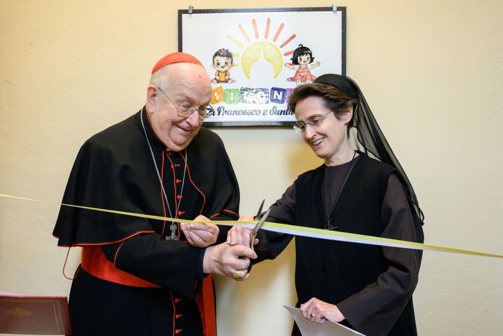 Franciscan Sr. of the Eucharist Raffaella Petrini cuts ribbon at nursery school for children of Vatican employees at the Vatican.