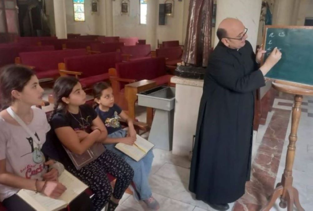 Priest at blackboard