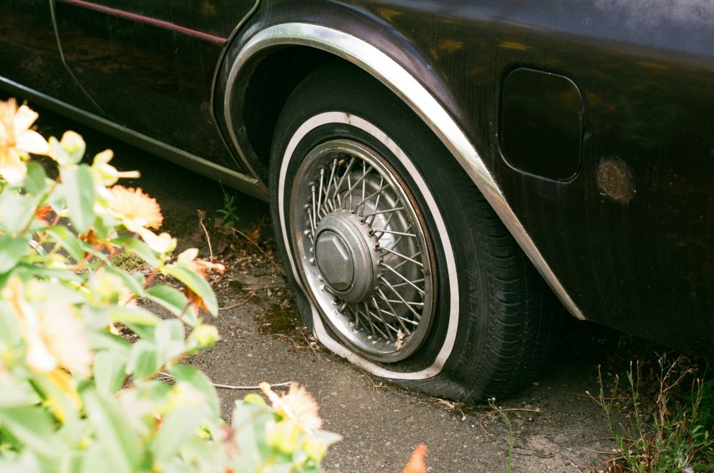 car with flat tire
