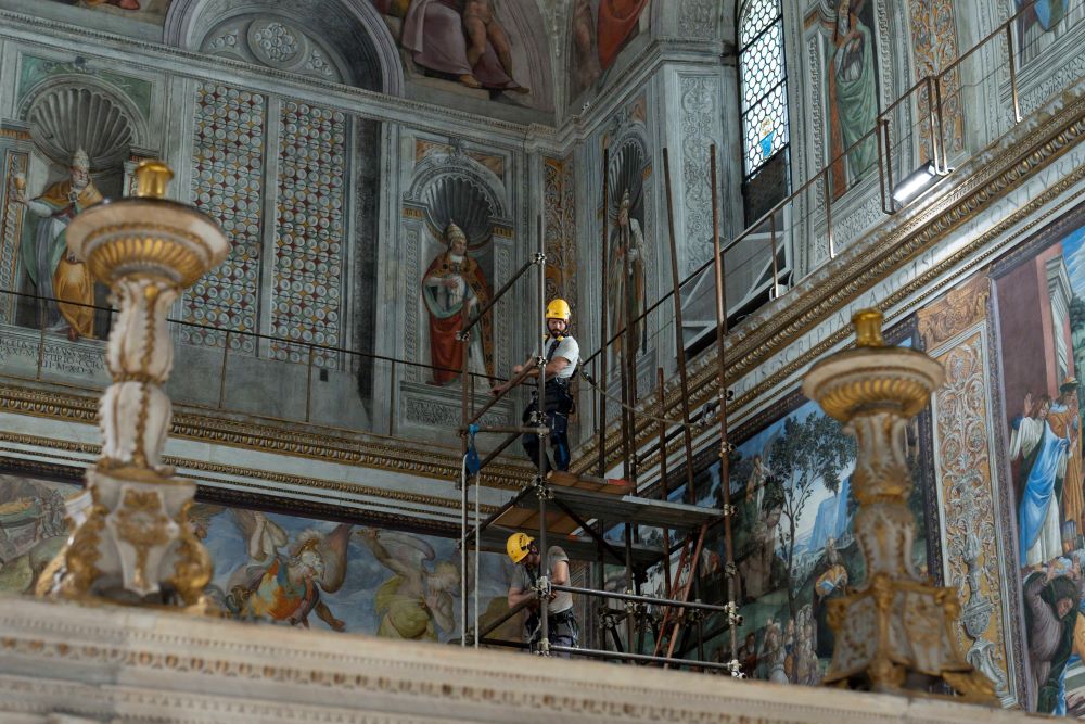 Workers prepare Sistine Chapel.