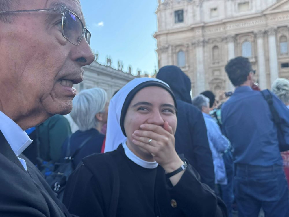 Sr. Claudia Verenisse Blanco, of the Servants of God in El Salvador, stands next to Cardinal Gregorio Rosa Chávez of San Salvador, El Salvador, reacts as white smoke rises from the Sistine Chapel, signaling the election of a new pope May 8. (GSR photo/Rhina Guidos) Sr. Claudia Verenisse Blanco, of the Servants of God in El Salvador, stands next to Cardinal Gregorio Rosa Chávez of San Salvador, El Salvador, reacts as white smoke rises from the Sistine Chapel, signaling the election of a new pope May 8. (GSR photo/Rhina Guidos)