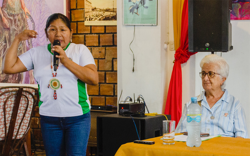 Sr. Araceli Guimera, right, listens to Mari Luz Canaquiri during a press conference about the rights of nature case in 2023 (IDL/Alan Benavides)