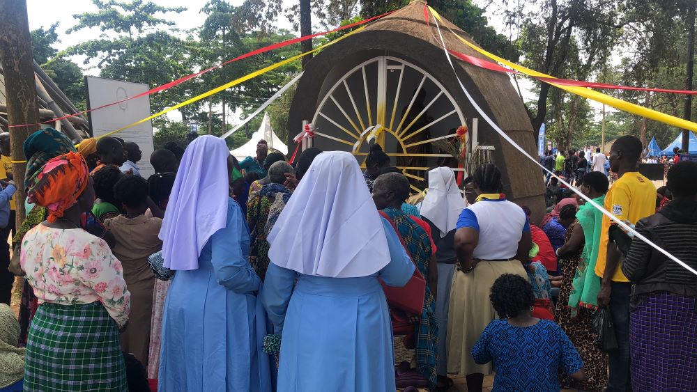Catholic sisters and other pilgrims face the shrine of St. Charles Lwanga at Namugongo.  Catholic sisters and other pilgrims face the shrine of St. Charles Lwanga at Namugongo.