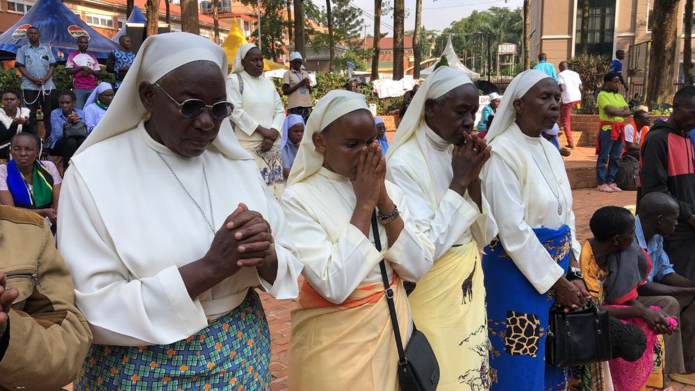 Catholic sisters pray at the  Uganda Martyrs Shrine at Namugongo in Kampala, Uganda's capital. The site honors 22 Catholics killed in the 19th century for refusing to denounce their faith. (GSR photo/Gerald Matembu) Catholic sisters pray at the  Uganda Martyrs Shrine at Namugongo in Kampala, Uganda's capital. The site honors 22 Catholics killed in the 19th century for refusing to denounce their faith. (GSR photo/Gerald Matembu)