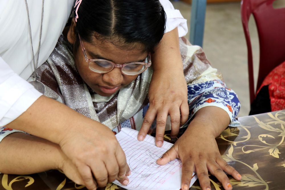 Sr. Nita Rozario with child Sr. Nita Rozario with child