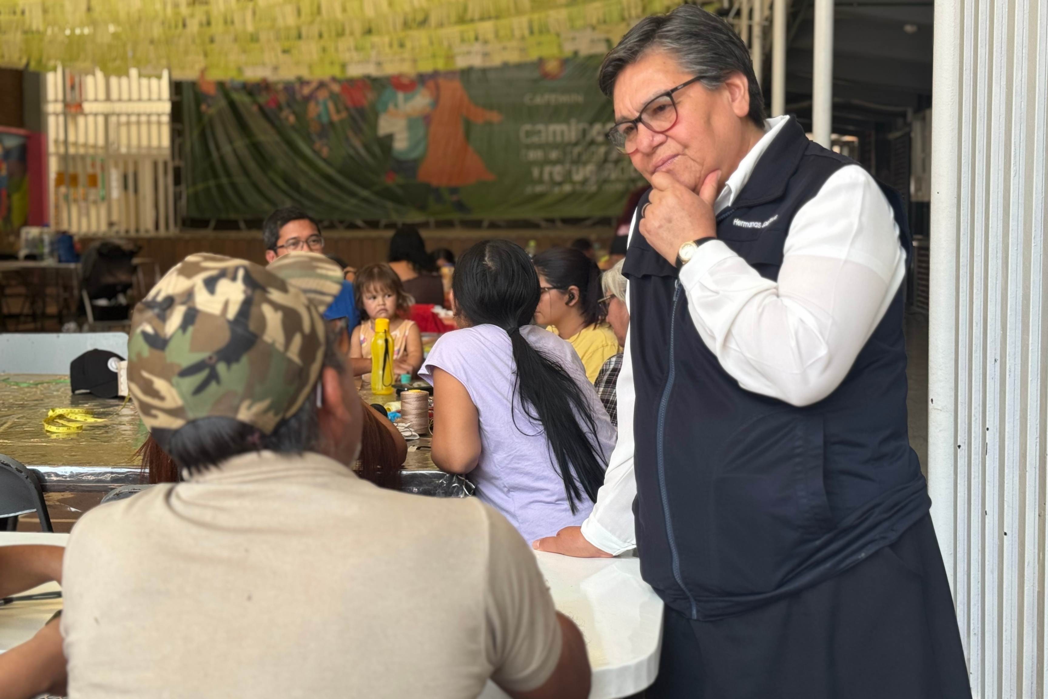 Sr. María Magdalena Silva Rentería listens to a man looking for work Apr 1, 2025, at the CAFEMIN shelter in Mexico City. (GSR photo/Rhina Guidos)
