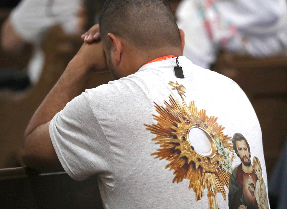 A man prays during perpetual adoration at St. John the Evangelist Church in Indianapolis during the opening of the National Eucharistic Congress July 17, 2024. (OSV News photo/Bob Roller)