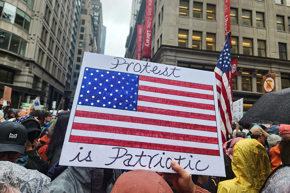 Signs appealing to patriotism and American values were common during the June 14 "No Kings" demonstration in Midtown Manhattan, N.Y. (GSR photo/Chris Herlinger)