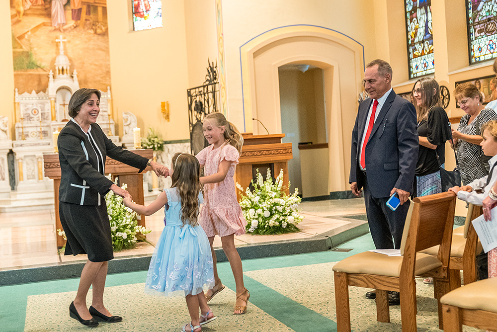 Sr. Linda Yankoski dances with relatives at her 50th jubilee as a Sister of the Holy Family of Nazareth in 2022. (Courtesy of Holy Family Institute)