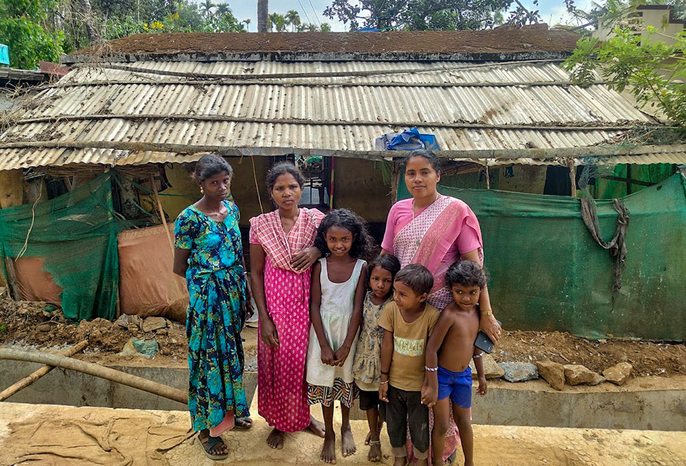 Charity Sr. Joicy Joy with children and women of Panthalam Unnati, an enclave at Kakkavayal, a village in the Wayanad district of Kerala, India. (George Kommattam)
