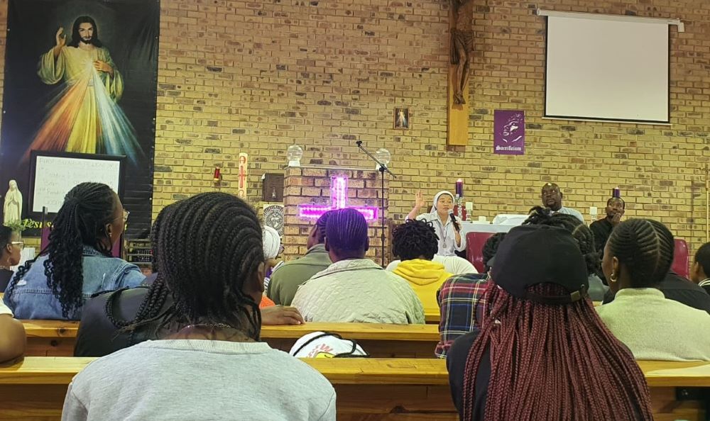 Sr. Thao Phi addresses the audience during a Lenten retreat for youth and young adults. Sr. Thao Phi addresses the audience during a Lenten retreat for youth and young adults.