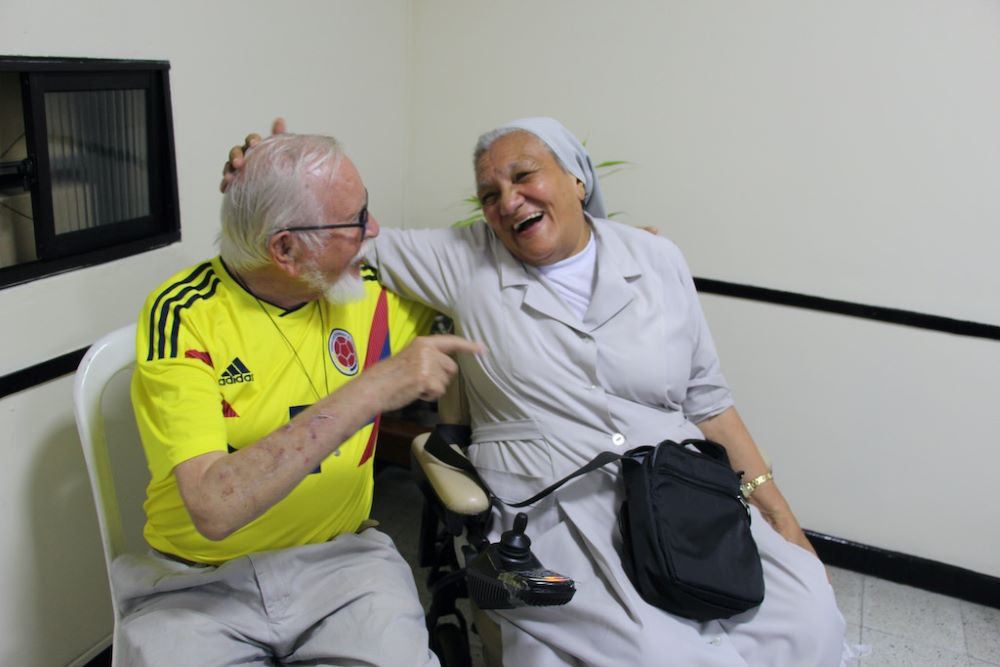 Sr. Rosa Cadavid laughs with Fr. Wilfred Weber Sr. Rosa Cadavid laughs with Fr. Wilfred Weber