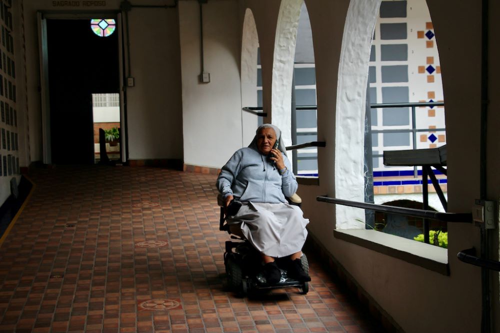 Sr. talks on cellphone Sr. Rosa talks on cellphone