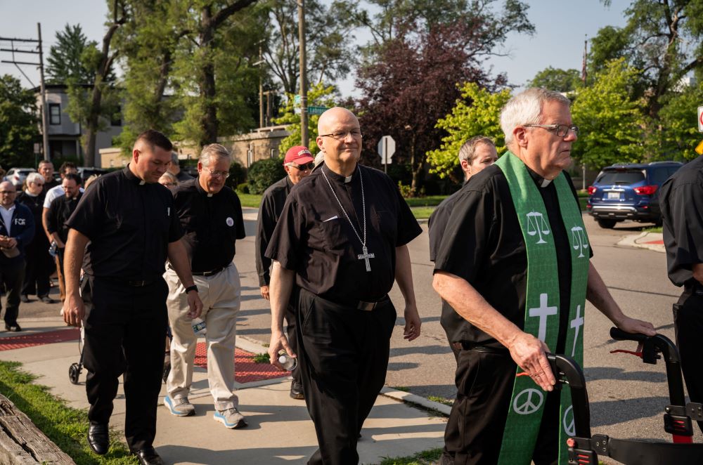 Detroit Archbishop Edward Weisenburger joins other clergy during a procession supporting immigrants.