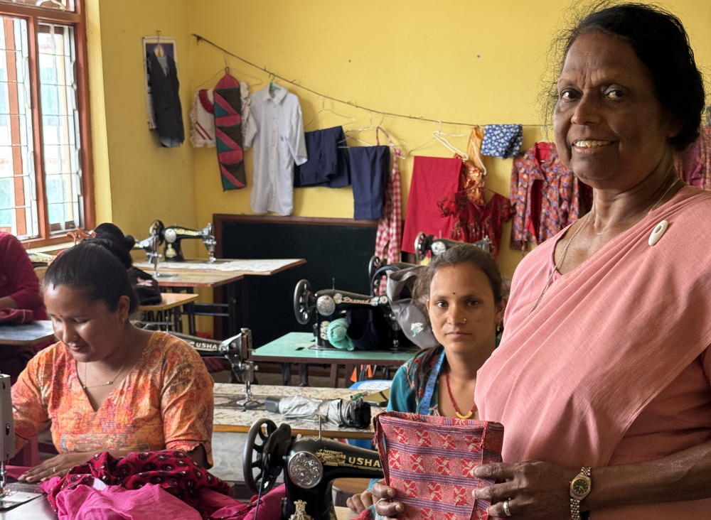 Sr. Rosita Kavilpurayidom poses with women participating in a tailoring training program. Sr. Rosita Kavilpurayidom poses with women participating in a tailoring training program.