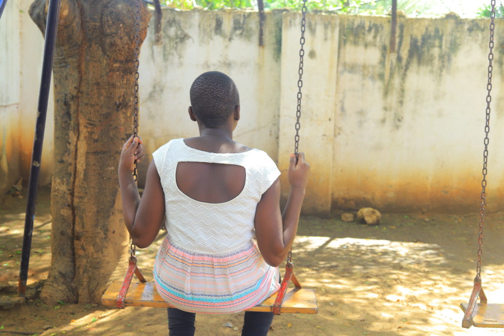 Girl on a swing A girl sits alone on a swing at Mahali Pa Usalama, a safe haven run by Catholic sisters for survivors of sexual exploitation. (GSR photo/Doreen Ajiambo)