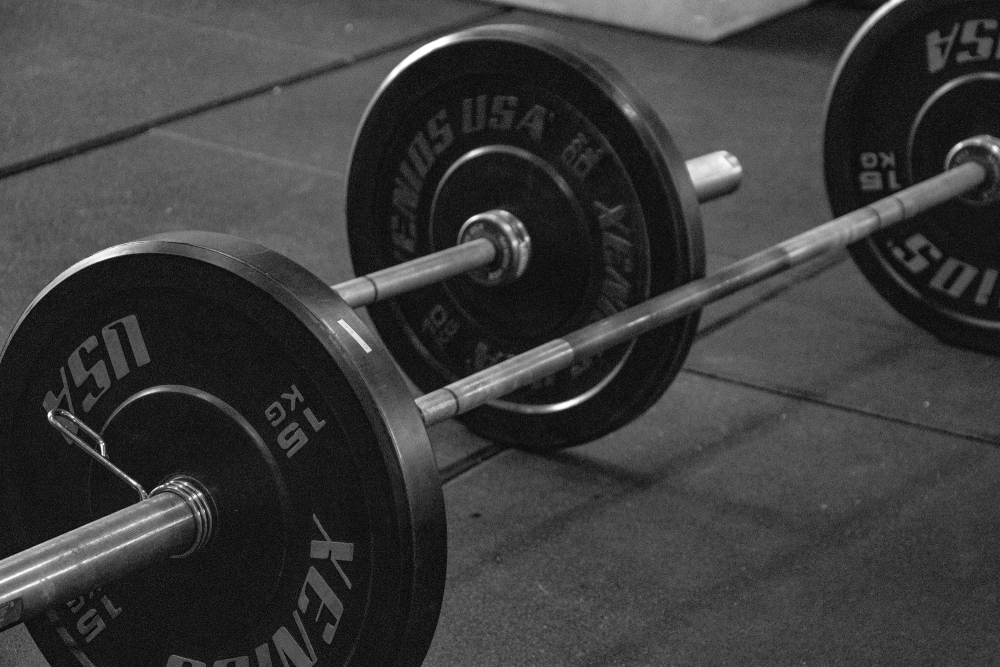 Weights Two 25kg weights on the floor