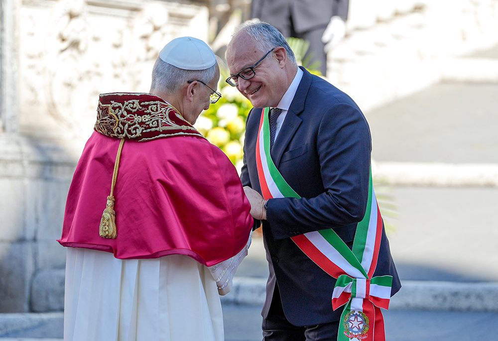 Pope Leo XIV and Rome Mayor Roberto Gualtieri shake hands after exchanging remarks in Aracoeli Square in Rome May 25, 2025. (CNS/Lola Gomez)