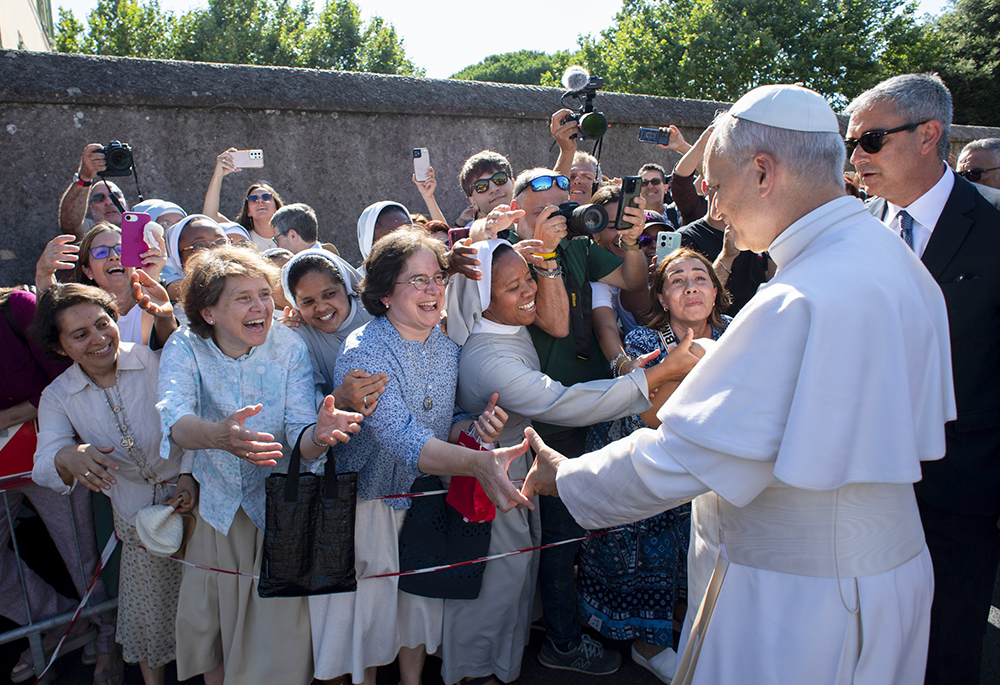 Pope Leo XIV greets people as he arrives in Castel Gandolfo, Italy, July 6, 2025, after reciting the Angelus at the Vatican. (CNS photo/Vatican Media)