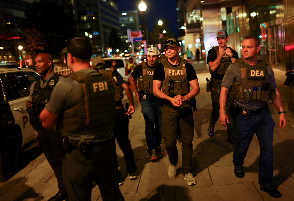 Members of the Drug Enforcement Administration and police patrol near Navy Yard in Washington Aug. 14, 2025, after President Donald Trump's announcement of the federal takeover of the Metropolitan Police Department under the Home Rule Act and the deployment of the National Guard to assist in crime prevention in the nation's capital. (OSV News/Reuters/Jose Luis Gonzalez)