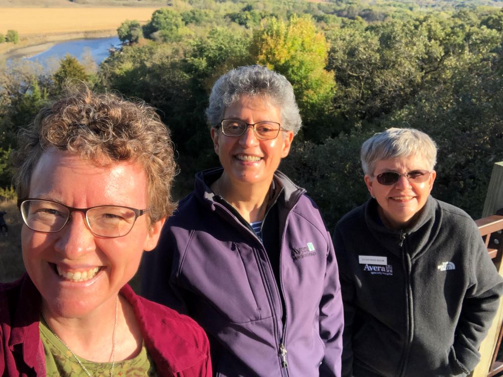 Sr. Vicky Larson poses during a hike with two other women. Sr. Vicky Larson poses during a hike with two other women.