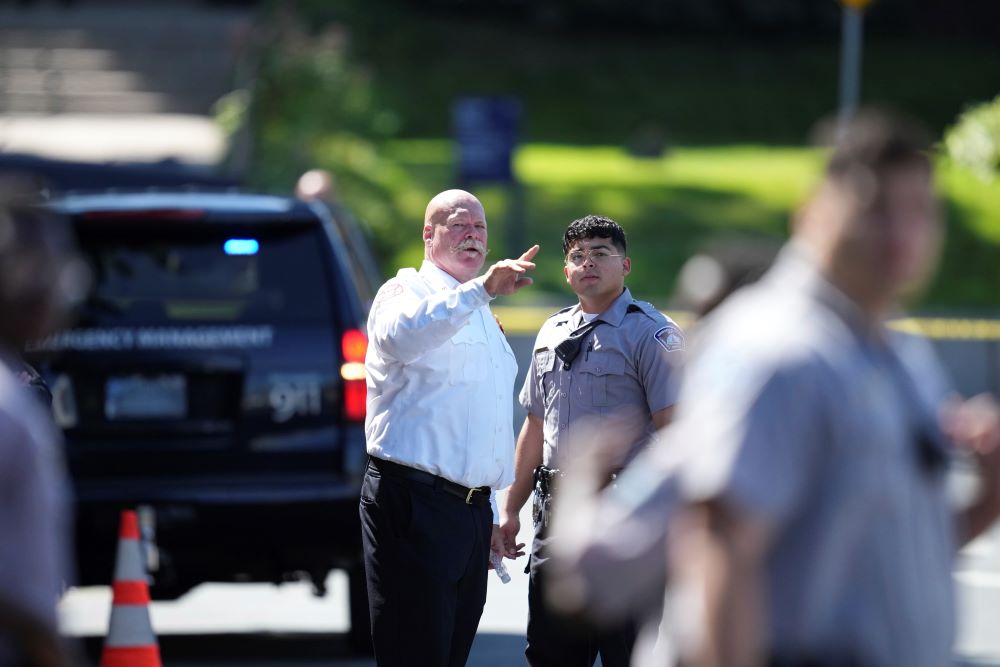 Law enforcement officers gather outside the Annunciation Church's school. Law enforcement officers gather outside the Annunciation Church's school.