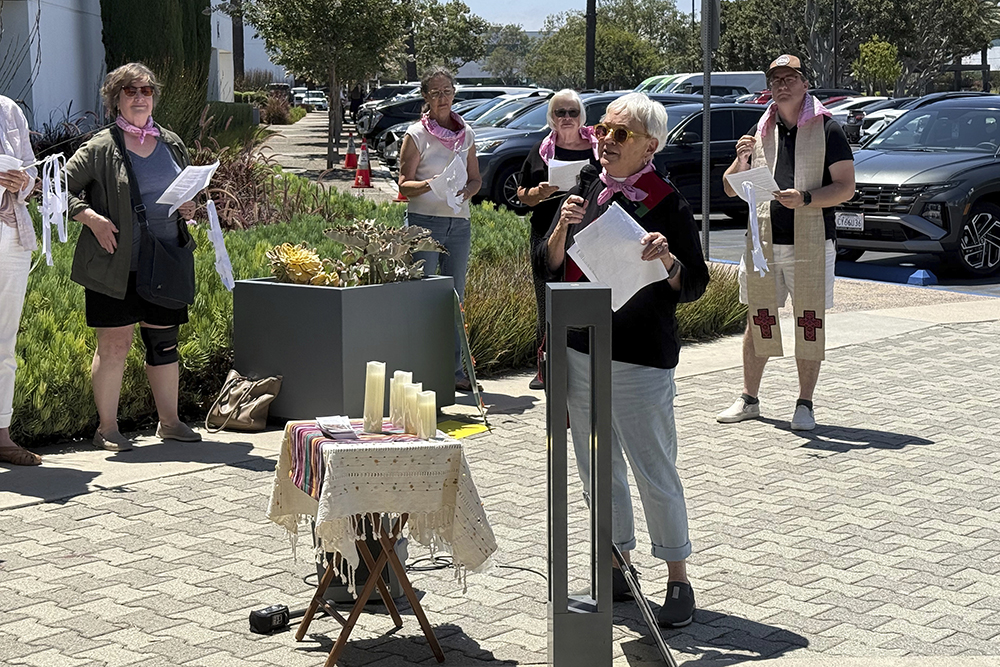 Laura Siriani, archdeacon of the Episcopal Diocese of Los Angeles, speaks at a prayer vigil for immigrants outside Santa Ana Immigration Court in Santa Ana, Calif., July 31, 2025. (AP Photo/Deepa Bharath)