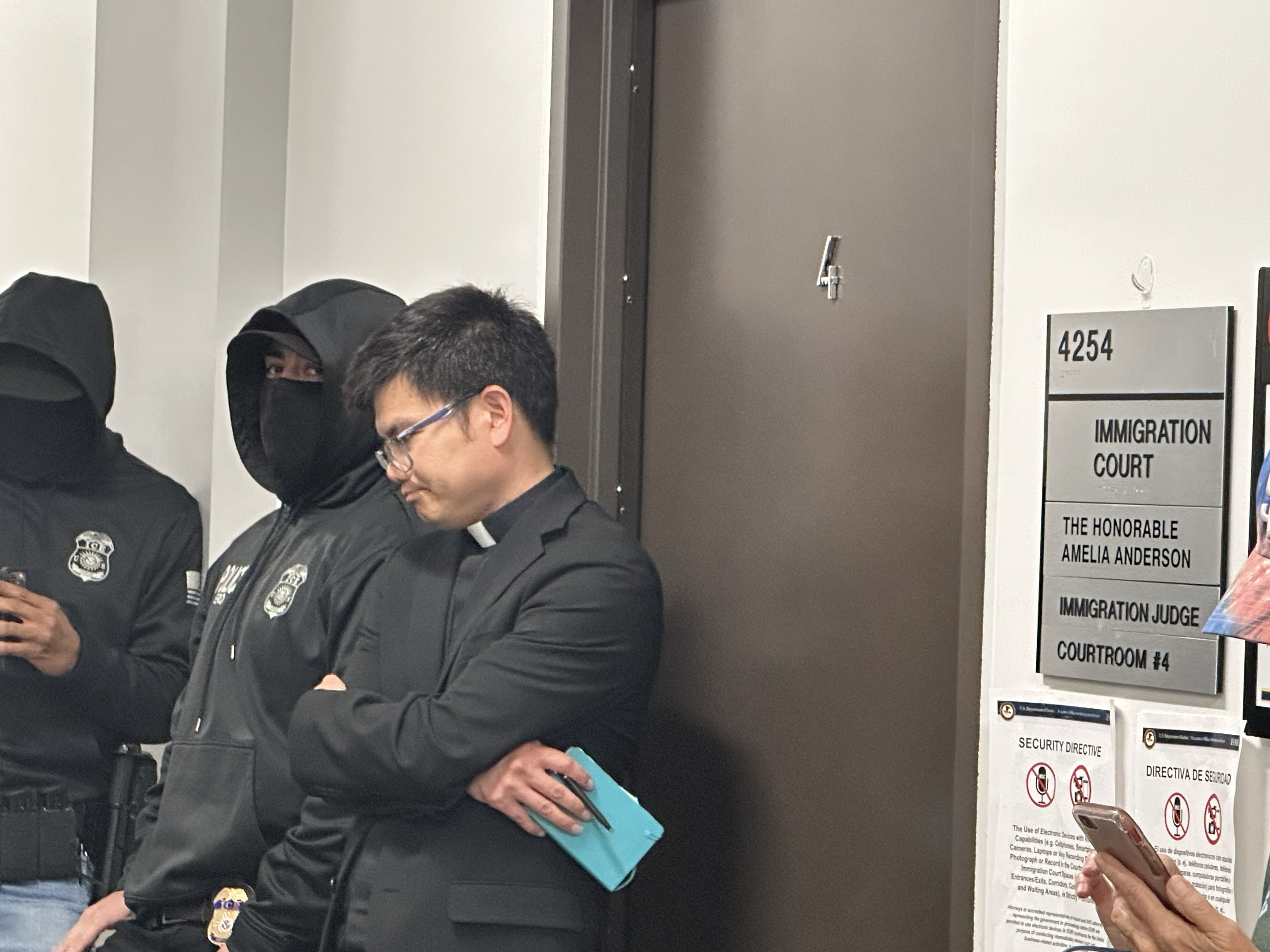 The Rev. Hung Nguyen, SJ, of Our Lady of Guadalupe Church in San Diego waits outside immigration court Aug. 6, 2025, the second day of the San Diego diocese's FAITH ministry. (NCR photo/Chris Stone) The Rev. Hung Nguyen, SJ, of Our Lady of Guadalupe Church in San Diego waits outside immigration court Aug. 6, 2025, the second day of the San Diego diocese's FAITH ministry. (NCR photo/Chris Stone)