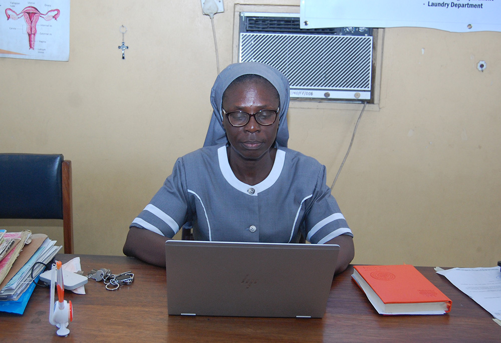 Medical Missionaries of Mary Sr. Maria Obotama, who manages the Family Life Center, in her office. The sisters provide free obstetric fistula surgeries, family planning and maternal health services to women in Mbribit Itam, Nigeria. (Valentine Benjamin)
