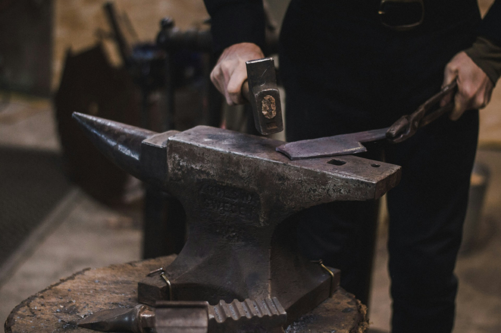 (Unsplash/Maranda Vandergriff) A blacksmith hammering metal
