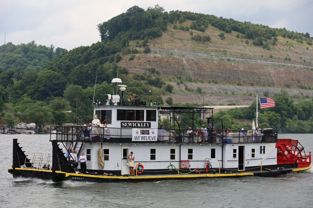 From the sternwheeler in the Eucharistic procession on the Ohio River for Seton Route of the National Eucharistic Pilgrimage June 24, 2024, Bishop Mark E. Brennan of Wheeling-Charleston, W.Va., bestows a Eucharistic blessing to the faithful gathered at the Wellsburg Wharf in Wellsburg, W.Va. (OSV News/The Catholic Spirit/Colleen Rowan) From the sternwheeler in the Eucharistic procession on the Ohio River for Seton Route of the National Eucharistic Pilgrimage June 24, 2024, Bishop Mark E. Brennan of Wheeling-Charleston, W.Va., bestows a Eucharistic blessing to the faithful gathered at the Wellsburg Wharf in Wellsburg, W.Va. (OSV News/The Catholic Spirit/Colleen Rowan)