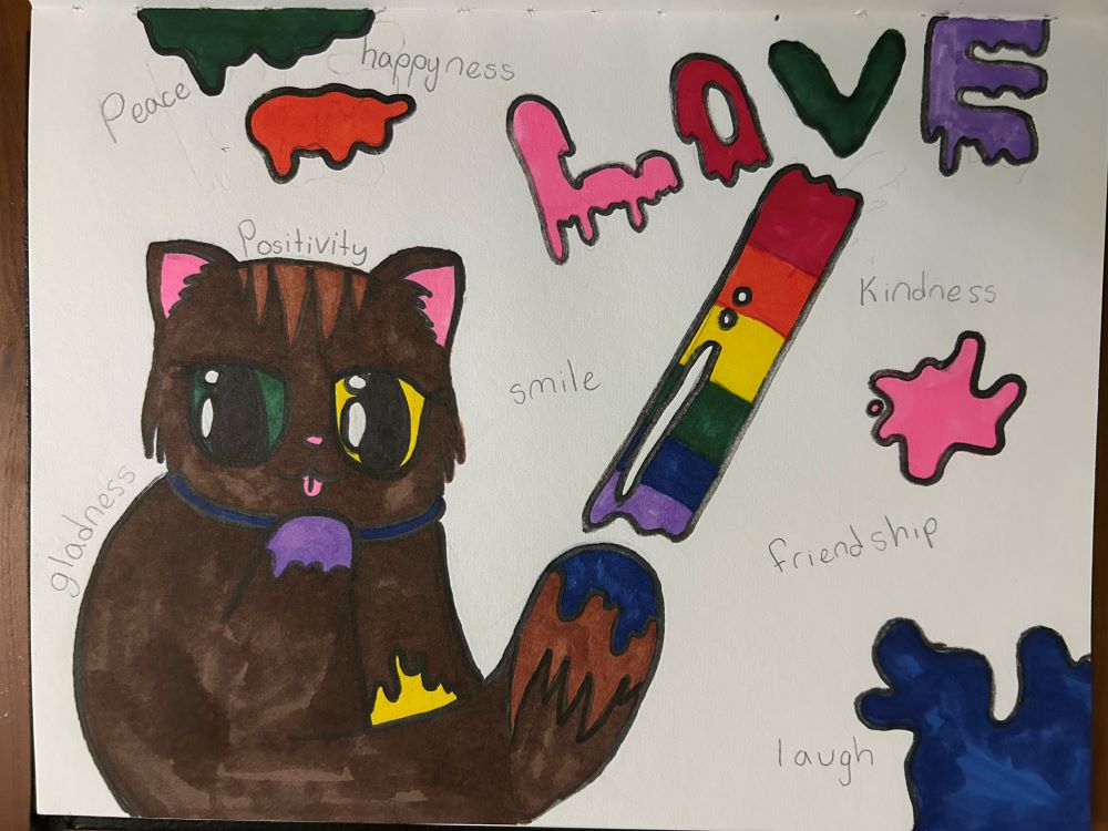 Child's drawing shows cat and the word love.