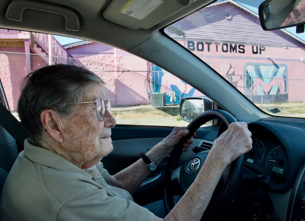 Sr. Julia Huiskamp drives past Bottoms Up, a strip club. 