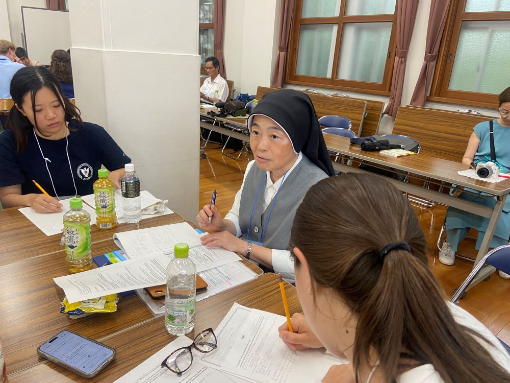 Sr. Kumiko Sakamoto facilitates a small group session. Sr. Kumiko Sakamoto facilitates a small group session.