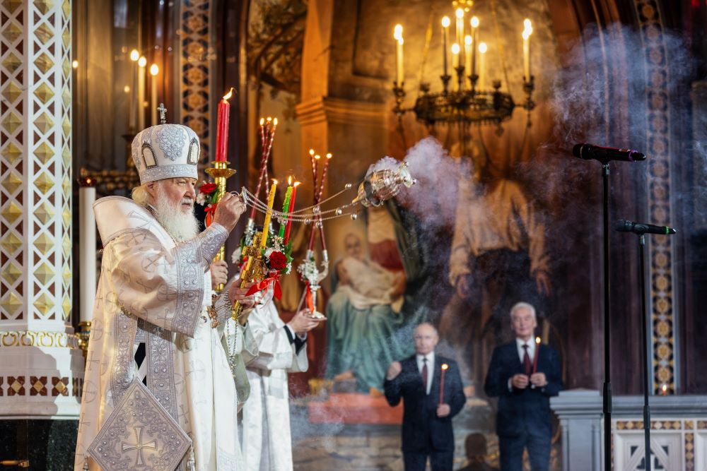 Russian Orthodox Church Patriarch Kirill, left, leads the Orthodox Easter service as Russian President Vladimir Putin, left, and Moscow Mayor Sergei Sobyanin stand nearby. Russian Orthodox Church Patriarch Kirill, left, leads the Orthodox Easter service as Russian President Vladimir Putin, left, and Moscow Mayor Sergei Sobyanin stand nearby.