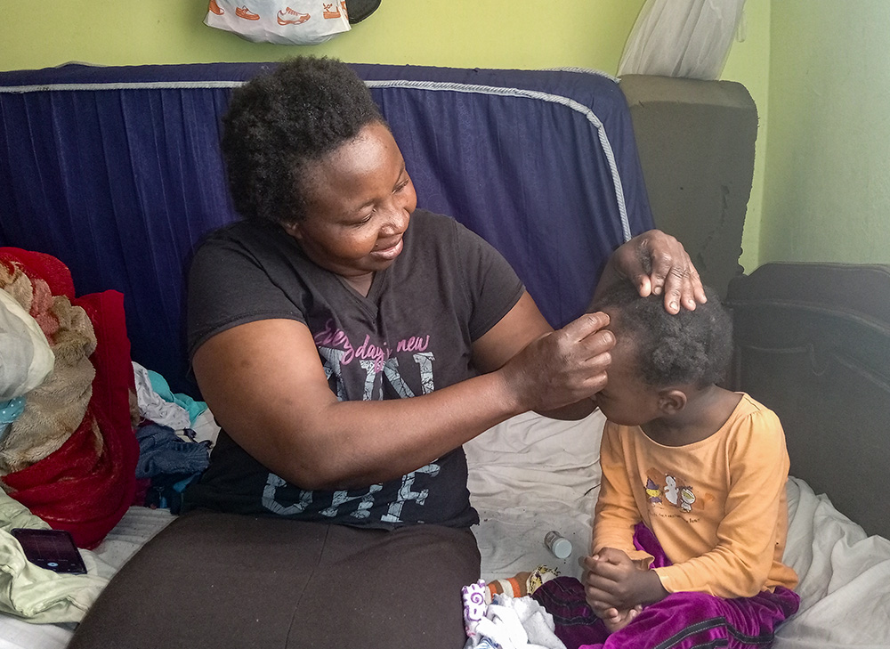 Jackline Nzau, 40, at her home after giving birth to her daughter at Nazareth Hospital in 2022. Nazareth Hospital was founded in 1964 by the Consolata Sisters as a tiny dispensary, rooted in the coffee and tea estates of Limuru, Kiambu County, Kenya. Today, the hospital is now run by the Franciscan Sisters of the Immaculate Heart of Mary and offers a range of services, including surgery, oncology, dialysis and critical care. (Gitonga Njeru)